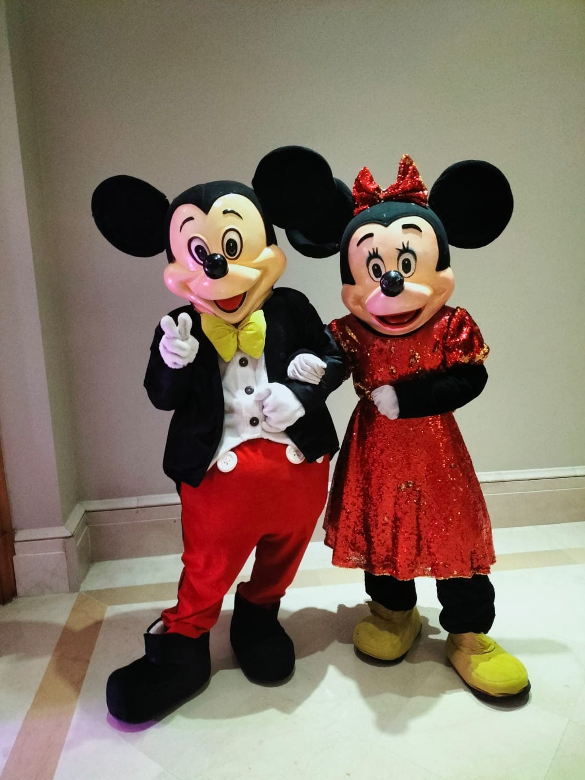 Costume mascots entertaining guests at a birthday party