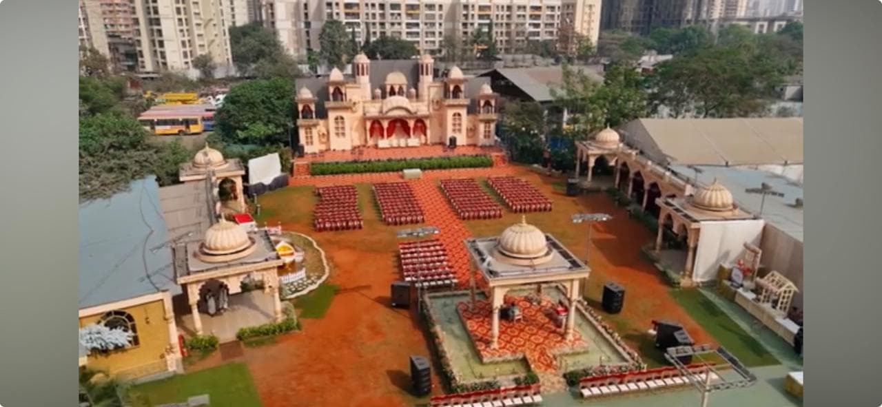 Grand outdoor wedding venue with palace façade and seating