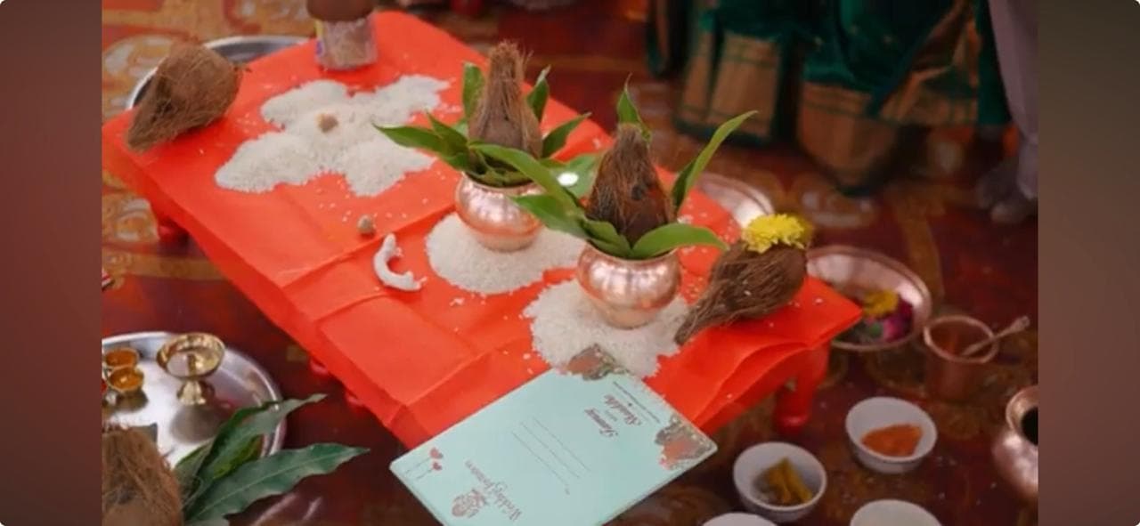 Copper kalash and rice arranged for a wedding ceremony